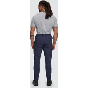 Flexi work pants in navy, featuring a flexible fit and water-repellent fabric. The model is seen from the back.