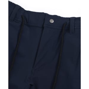 A pair of navy blue water repellent flexi work pants featuring a button and drawstring waist. The garment has a logo.