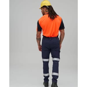 Flexi work pants in navy with reflective tapes, worn by a person in an orange shirt and yellow hard hat.