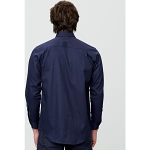 A navy long-sleeve work shirt with a pocket, featuring a logo on the fabric.