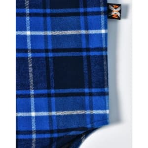 A blue and navy quilted flannel shirt with a checked pattern and a logo tag.