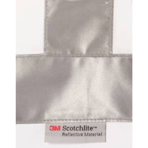 A reflective silver strip on a white fabric with a label for 3M Scotchlite reflective material.