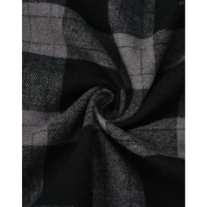 A close-up of black and grey flannel fabric featuring a plaid pattern, showcasing the texture and design.