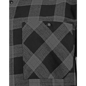 A unisex flannel plaid shirt in shades of black and grey, featuring a button-up design and a chest pocket.