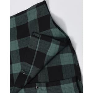 A unisex flannel plaid shirt featuring green and black check patterns, with button-up details and a logo.