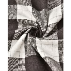 A close-up of grey and white flannel fabric with a plaid pattern, showing the texture and weave.