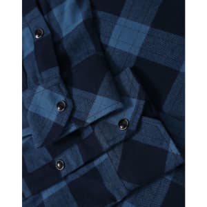 A blue and navy plaid flannel shirt with button-up detailing and a pocket. It features metal snap buttons.