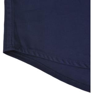 A navy blue long-sleeve work shirt with a closed front and a branded logo. Detailed hemline visible.