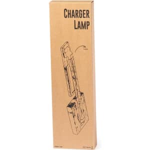 A rectangular box containing a charger lamp, featuring a minimalistic design and a logo on the packaging.