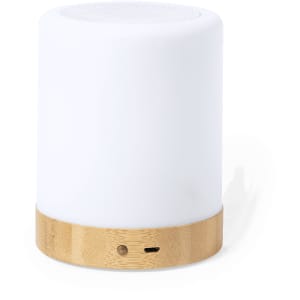 A white speaker with a bamboo base, featuring a logo and a port for charging.