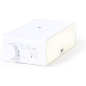 A white multifunction alarm clock with knobs and buttons, featuring a USB port and minimalistic design.