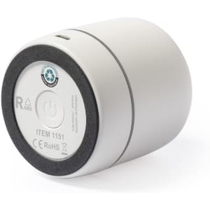 A white cylindrical speaker with a grey base, featuring a power button and a logo on the bottom.