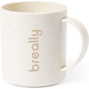 A cream-coloured coffee mug with a textured finish and a handle. It features a logo on the side.