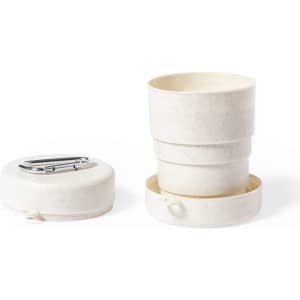 A foldable cup in cream colour, designed for convenient storage, with a silver clip and a base.