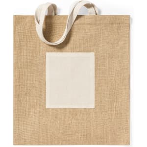 A tan tote bag made from natural materials with a blank patch on the front and sturdy handles.