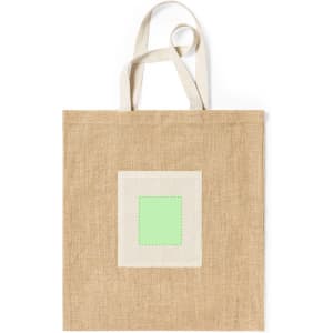 A tan tote bag with natural fabric and a green square patch in the centre. It has two shoulder straps and a simple design.
