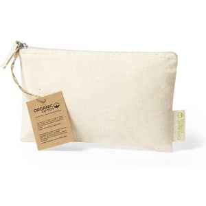 A cream toiletry bag made from organic cotton, featuring a zip closure and a tag with information.