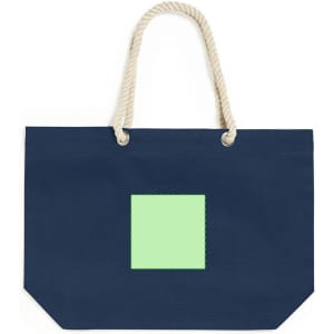 A navy tote bag with a green square patch and rope handles. The bag features a branding logo.