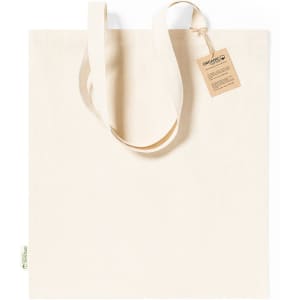 A natural-coloured tote bag with long handles, featuring a tag and a simple design. Includes a logo.