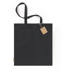 A black tote bag with long handles and a tag, featuring a simple and minimalist design.