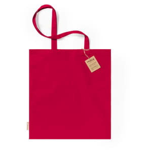A red tote bag with two straps and a tag attached, featuring a simple design.