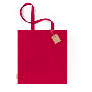 A red tote bag with two handles and a tag, featuring a simple design and a branding logo.