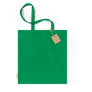 A green tote bag with two handles and a tag attached, featuring a logo on the side.