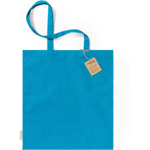 A turquoise tote bag with two handles and a tag attached. The bag features a logo or branding.
