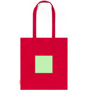 A red tote bag with a square green design. The bag features long handles and has a logo.