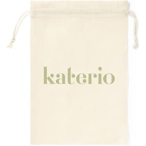 A drawstring bag in cream with a logo in soft green. The bag features a top drawstring closure.