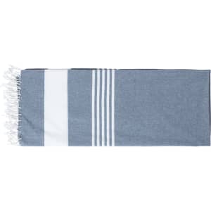 A blue and white beach mat with stripes and fringed edges, featuring a logo.