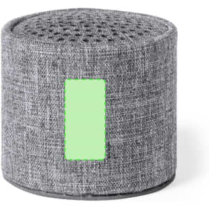 A grey fabric speaker with a circular shape and a textured surface. It features a branding logo on the side.