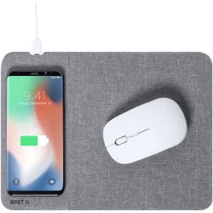 A grey mousepad with a wireless charger, featuring a smartphone displaying charge status and a white mouse.