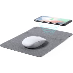 A grey mousepad with a wireless charger featuring a white mouse and a smartphone above it.