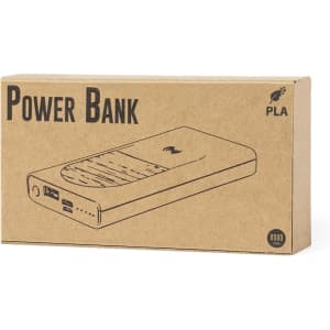 A power bank in a cardboard box, featuring a simple design with a logo, shown in neutral tones.