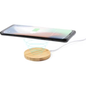 A wireless charger with a wooden base, featuring a smartphone hovering above it, displaying a charging icon.