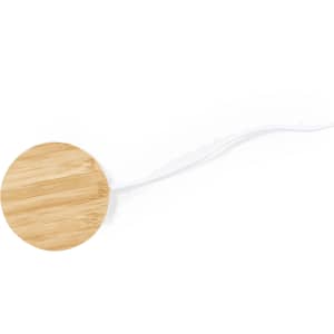 A round wireless charger with a bamboo surface and a white cable. The design is sleek and minimalistic.