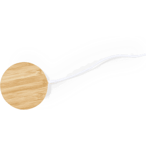 A wireless charger with a circular bamboo surface and a connected white cable, showcasing a natural wood finish.