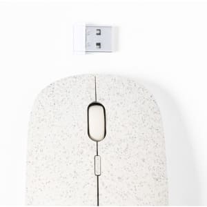 A white speckled computer mouse with a USB receiver positioned above it, featuring a simple design.