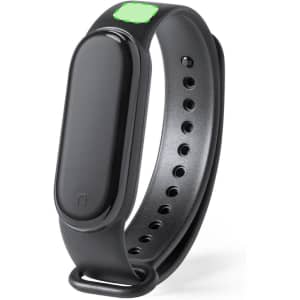A black smart bracelet with a slim design and a green highlight, featuring adjustable holes for a secure fit.