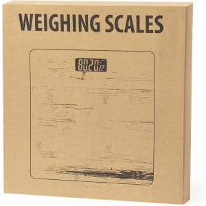 A brown cardboard box containing weighing scales, featuring a digital display on the front.