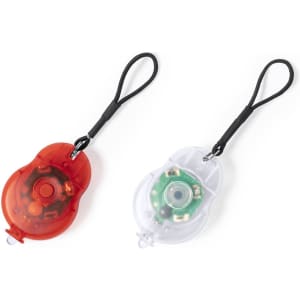 A red and a clear safety light set with straps, featuring visible internal components for outdoor use.