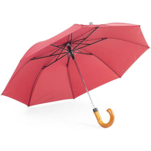 A red umbrella with a curved wooden handle and a metal frame. It has a logo on its canopy.
