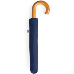 A navy blue umbrella with a wooden handle, packaged in a matching cover. It features a brand logo.