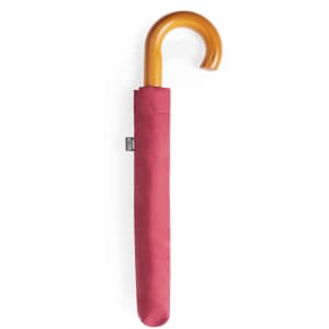 A maroon umbrella with a curved wooden handle, encased in a matching cover. The umbrella features a logo.