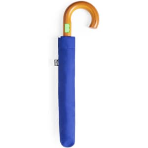 A blue umbrella with a wooden handle, stored in a matching sleeve. The umbrella features a logo on the sleeve.
