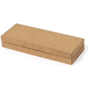 A cork gift box with a rectangular shape, featuring a simple, natural texture. It has a minimalistic design.