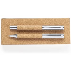 A set of two metal pens with cork grips, displayed on a cork tray. The pens have silver accents.