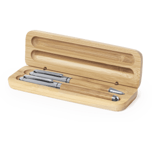 A bamboo pen box containing three pens with silver accents. The box is open, showcasing its natural wood finish.