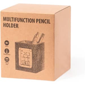 A brown cardboard box containing a multifunction pencil holder with a digital display for time, alarm, and temperature.
